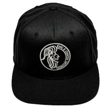 Load image into Gallery viewer, All black snapback hat for men and women embroidered in Vancouver, BC, Canada with the King &amp; Country Grooming Lion logo.