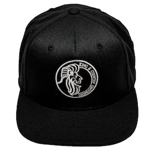 All black snapback hat for men and women embroidered in Vancouver, BC, Canada with the King & Country Grooming Lion logo.